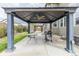 Outdoor patio featuring a pergola with a ceiling fan, a grill, and a table, perfect for outdoor entertaining at 11801 E 118Th Ave, Commerce City, CO 80640
