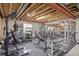 Fully equipped basement gym with various exercise machines and free weights at 11801 E 118Th Ave, Commerce City, CO 80640