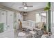Cozy Bedroom features a white crib, soft gray carpet, and a decorative giraffe and stuffed animals at 11801 E 118Th Ave, Commerce City, CO 80640
