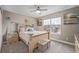Bedroom with a beige bed frame, neutral walls, plush carpeting, and ample natural light from a window at 11801 E 118Th Ave, Commerce City, CO 80640