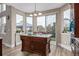 Bright kitchen featuring a wood island with white countertops, pendant lighting, and hardwood floors at 11801 E 118Th Ave, Commerce City, CO 80640