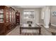 Cozy living room showcasing elegant wood flooring, ample natural light, and classic furniture at 11801 E 118Th Ave, Commerce City, CO 80640