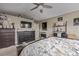 Comfortable main bedroom with dark wood furniture, decorative accents, and ample storage space at 11801 E 118Th Ave, Commerce City, CO 80640