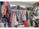Well-organized walk-in closet with clothing racks, shelving, and storage for shoes and accessories at 11801 E 118Th Ave, Commerce City, CO 80640