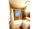 This well-lit bathroom features a shower-tub combination and a modern vanity at 3231 S Galapago St, Englewood, CO 80110
