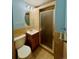 Cozy bathroom featuring stylish tile walls, shower, and a round mirror at 3231 S Galapago St, Englewood, CO 80110