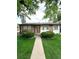 Charming single-story home featuring a stone facade and well-manicured front yard at 3231 S Galapago St, Englewood, CO 80110