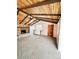 Spacious living room with wood ceiling, stone fireplace, and neutral carpet at 3231 S Galapago St, Englewood, CO 80110