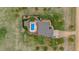 Aerial view of a backyard featuring a sparkling pool, lounge area, and well-maintained landscaping at 330 N Rocky Cliff Trl, Franktown, CO 80016
