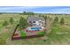 Inviting backyard featuring a pool, patio, and lush greenery, perfect for outdoor living at 330 N Rocky Cliff Trl, Franktown, CO 80016