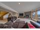 Finished basement featuring a fireplace, piano, and comfortable seating area at 330 N Rocky Cliff Trl, Franktown, CO 80016
