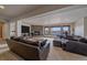 Large finished basement featuring a stone fireplace, a TV, and large comfortable seating at 330 N Rocky Cliff Trl, Franktown, CO 80016