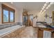 Bright bathroom with a soaking tub, separate shower, dual sinks, and large window with natural light at 330 N Rocky Cliff Trl, Franktown, CO 80016