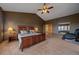 Large primary bedroom with a spacious layout, carpeted floors, ample natural light, and a convenient ensuite bathroom at 330 N Rocky Cliff Trl, Franktown, CO 80016