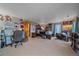 Large bedroom featuring a large bed, an office space, and comfortable seating area at 330 N Rocky Cliff Trl, Franktown, CO 80016