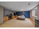 Bright bedroom with a bed, desk, and a window letting in natural light, complemented by neutral carpet at 330 N Rocky Cliff Trl, Franktown, CO 80016