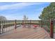Charming deck with a view, featuring wrought iron railings and cozy seating for outdoor relaxation at 330 N Rocky Cliff Trl, Franktown, CO 80016