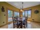 Dining area with a view leading out to the deck for al fresco dining experiences at 330 N Rocky Cliff Trl, Franktown, CO 80016