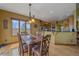 Comfortable dining area adjacent to the kitchen, featuring natural lighting and a scenic outdoor view at 330 N Rocky Cliff Trl, Franktown, CO 80016