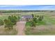 Beautiful ranch-style home with stone accents, mature trees, and lush green lawn at 330 N Rocky Cliff Trl, Franktown, CO 80016
