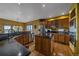 Spacious kitchen featuring stainless appliances, oak cabinets, granite countertops, and hardwood floors at 330 N Rocky Cliff Trl, Franktown, CO 80016