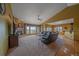 Expansive living room boasting a stone fireplace, hardwood floors, and scenic views from large windows at 330 N Rocky Cliff Trl, Franktown, CO 80016