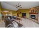 Inviting living room featuring a stone fireplace, vaulted ceilings, and comfortable seating at 330 N Rocky Cliff Trl, Franktown, CO 80016