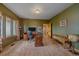 Well-appointed home office with natural light, comfortable seating, and room to work at 330 N Rocky Cliff Trl, Franktown, CO 80016