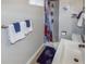 Bathroom featuring a white sink, toilet, and a shower with a patterned shower curtain at 3071 S Jasmine St, Denver, CO 80222