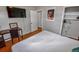 Bedroom featuring a cozy bed, closet space, desk, and bright window at 3071 S Jasmine St, Denver, CO 80222