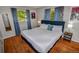 Bedroom featuring a comfortable bed and a window with natural light at 3071 S Jasmine St, Denver, CO 80222
