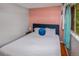 Bright bedroom featuring a comfortable bed and a window with natural light at 3071 S Jasmine St, Denver, CO 80222