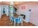 Dining room with hardwood floors, fireplace, and view of the backyard at 3071 S Jasmine St, Denver, CO 80222