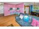 Inviting living area with pink vanity space, hardwood floors, and comfortable seating at 3071 S Jasmine St, Denver, CO 80222