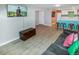 Living room with tile floors, a lounge area, and a wet bar at 3071 S Jasmine St, Denver, CO 80222