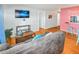 Comfortable living room with hardwood floors, light gray sofa, and modern décor at 3071 S Jasmine St, Denver, CO 80222