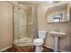 Updated bathroom featuring a tiled shower with glass door, vanity, and modern fixtures at 21710 Silver Meadow Ln, Parker, CO 80138