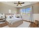 Cozy bedroom features a bright window and neutral decor at 21710 Silver Meadow Ln, Parker, CO 80138