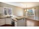 Open-concept kitchen with granite counters, stainless steel appliances and breakfast bar at 21710 Silver Meadow Ln, Parker, CO 80138