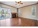Inviting living room featuring a cozy fireplace, hardwood floors and a sliding glass door at 21710 Silver Meadow Ln, Parker, CO 80138