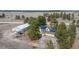 A rural homestead featuring a yellow home with solar panels and a matching shop set on a generous plot of land at 37677 Sable Ridge Rd, Elizabeth, CO 80107