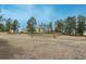 Expansive backyard featuring a charming fence, mature trees, and a picturesque setting at 37677 Sable Ridge Rd, Elizabeth, CO 80107