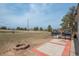 Backyard features a patio, a grill, an open grass area, and scattered trees in the distance at 37677 Sable Ridge Rd, Elizabeth, CO 80107
