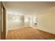 A large basement area with carpeted floors, neutral colored walls, and modern recessed and pendant lighting at 37677 Sable Ridge Rd, Elizabeth, CO 80107