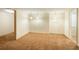 A large carpeted basement area with neutral colored walls and open doorway to other parts of the home at 37677 Sable Ridge Rd, Elizabeth, CO 80107