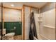 This bathroom features mixed wood and metal siding, a toilet, and a shower/tub combo at 37677 Sable Ridge Rd, Elizabeth, CO 80107