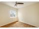 Neutral carpeted bedroom with ceiling fan and good natural light from the window at 37677 Sable Ridge Rd, Elizabeth, CO 80107