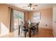Dining room with a wooden table, a sliding glass door to a deck, hardwood floors, and neutral colored walls at 37677 Sable Ridge Rd, Elizabeth, CO 80107