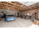 Spacious garage interior with exposed rafters offering ample space for car and motorcycle parking at 37677 Sable Ridge Rd, Elizabeth, CO 80107