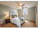 Bedroom showcasing carpet, ceiling fan, and natural light from the window at 37677 Sable Ridge Rd, Elizabeth, CO 80107